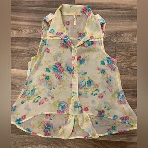 Truth ladies tank top with ties at the bottom. Size: L. Sheer.